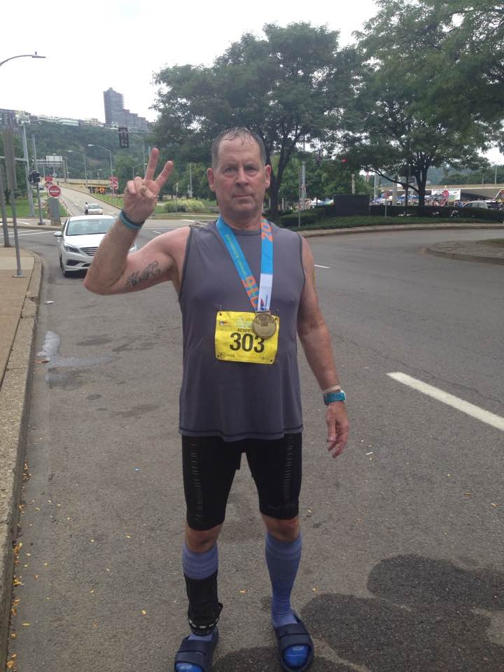 Robert with adventure race medal
